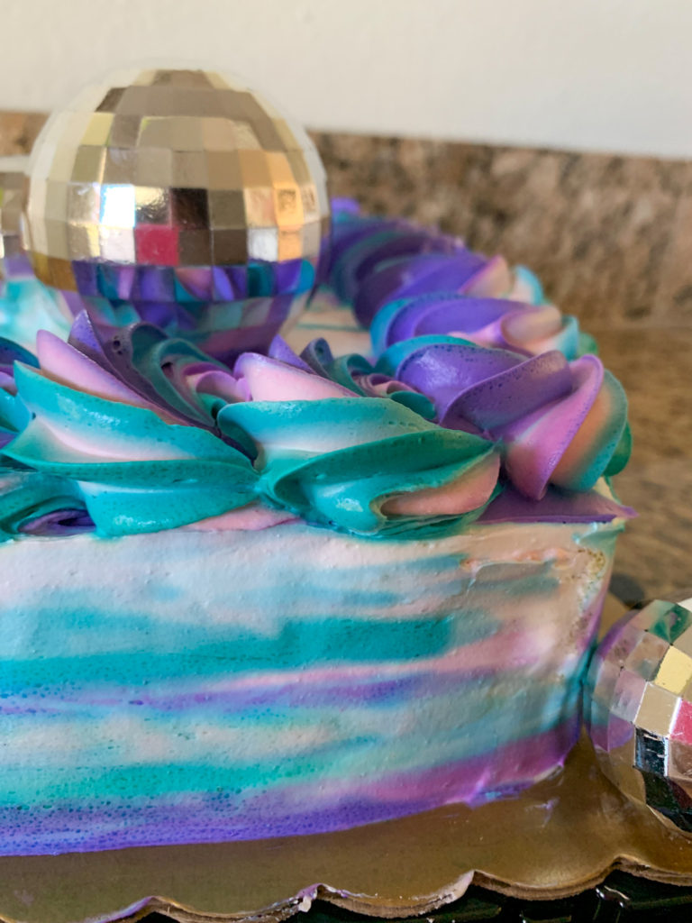 colorful cake with disco ball cake toppers