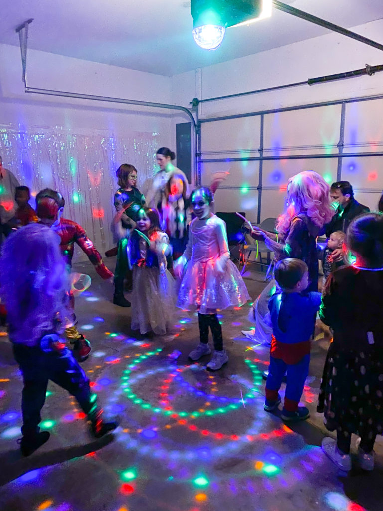 children play a music game at Halloween kids disco party