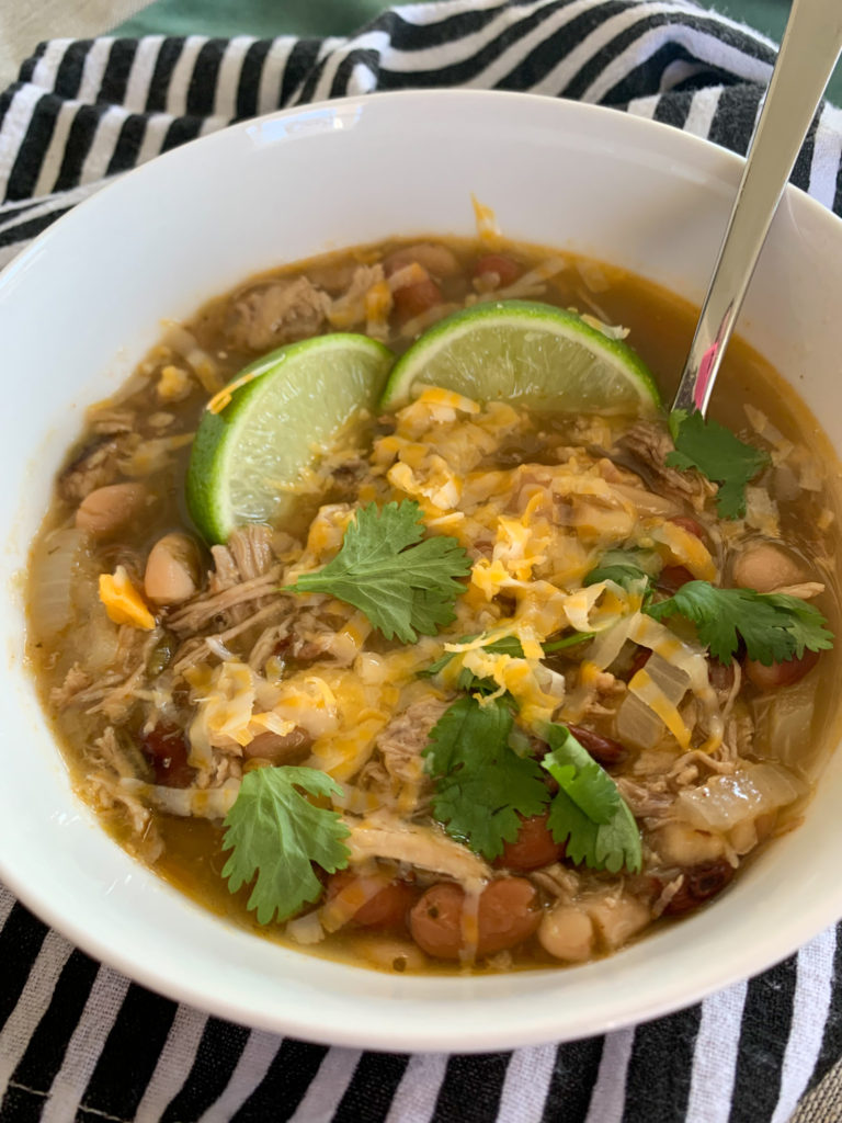 smoked pork green chili slow cooker in white bowl