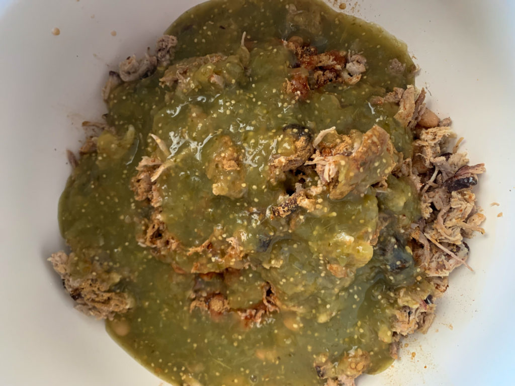 meat in salsa verde in bottom of Crock Pot