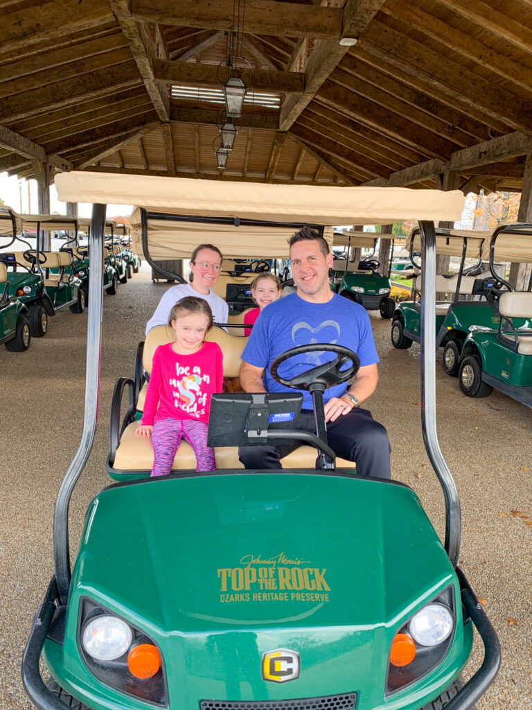 family in electric cart at Top of the Rock Big Cedar Lodge