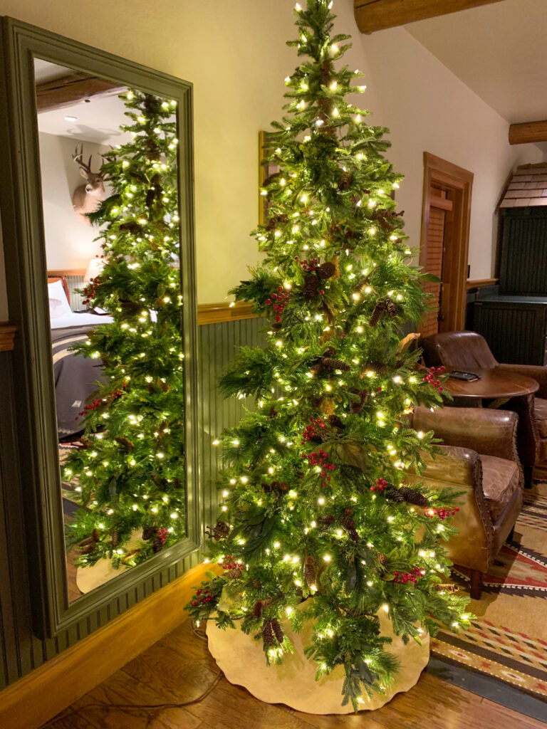 a Christmas tree inside a guest room at Big Cedar Lodge