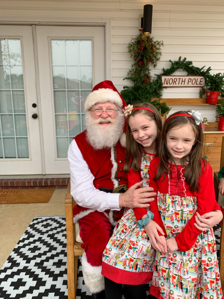 Santa Pete and two young children smiling 