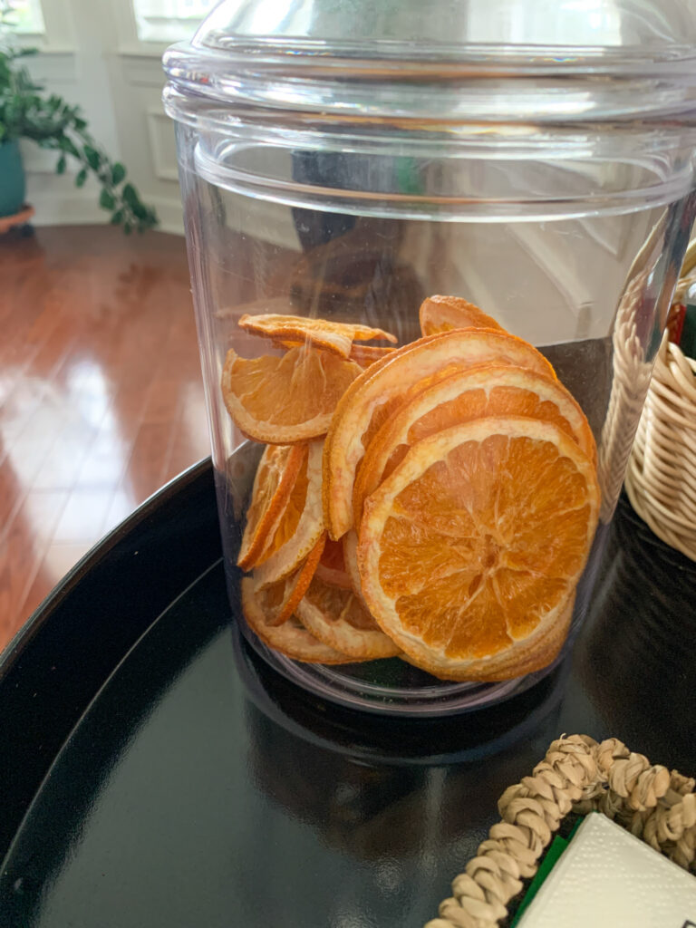 jar of dehydrated oranges on gold and black drinks trolley for gift ideas for drink lovers
