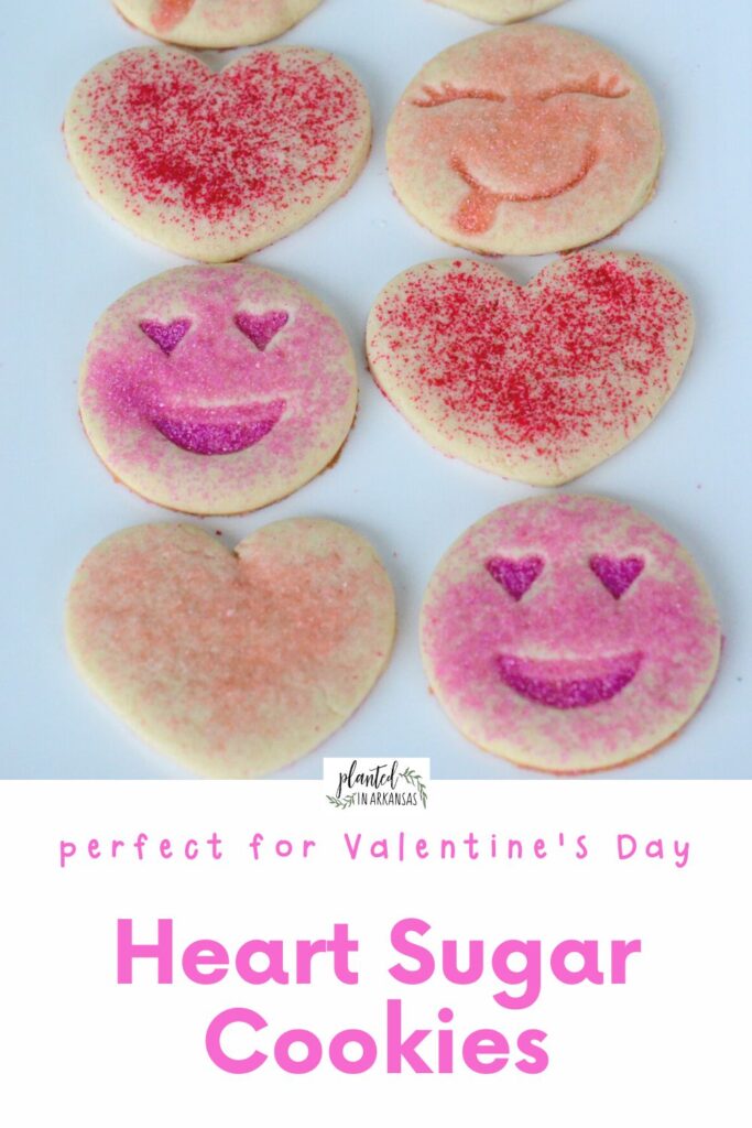 platter of pink sugar cookies - smiley face cookies and heart sugar cookies with text