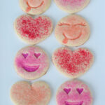pink sugar cookies on white platter