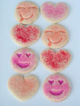 pink sugar cookies on white platter