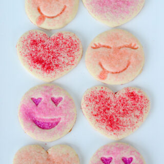 8 pink sugar cookies on serving tray