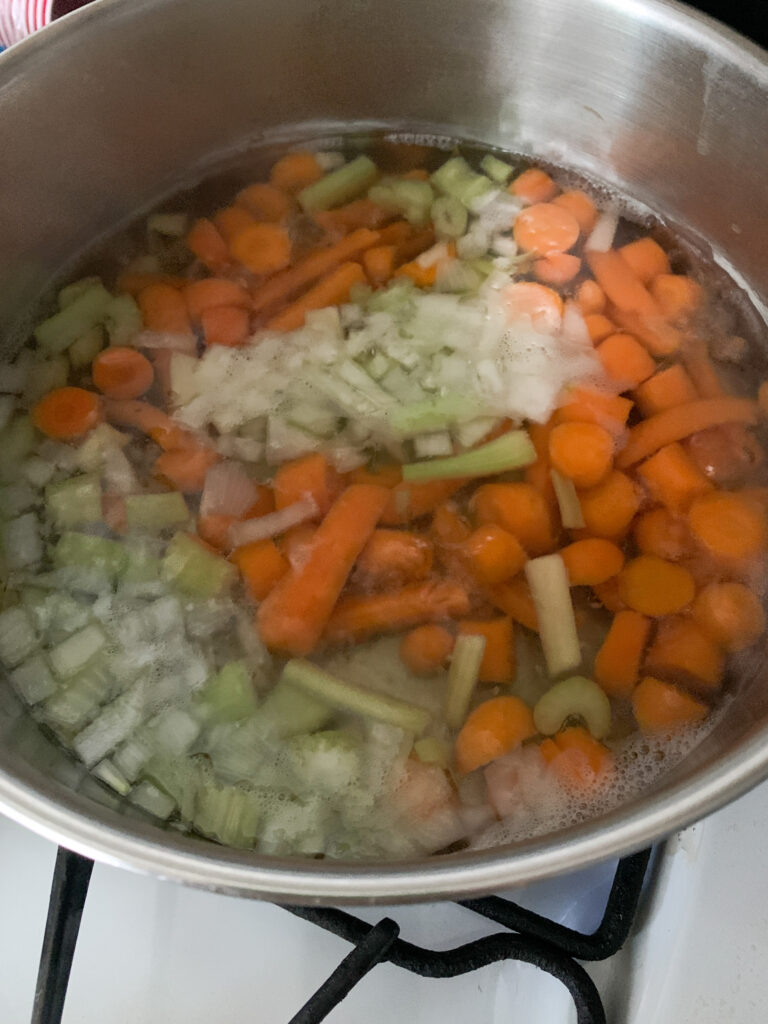 vegetables cooking in stainless steel pot
