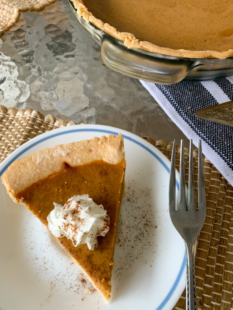 condensed milk pumpkin pie on blue and white plate