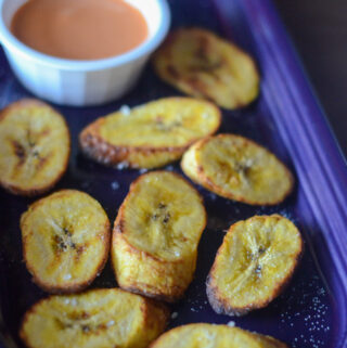 air fried plantains on purple tray with sriracha mayo