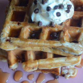 chocolate chip Belgian waffles on pink plate