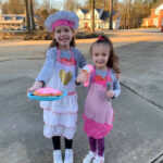 two little girls dressed up for Careers Day theme day at school