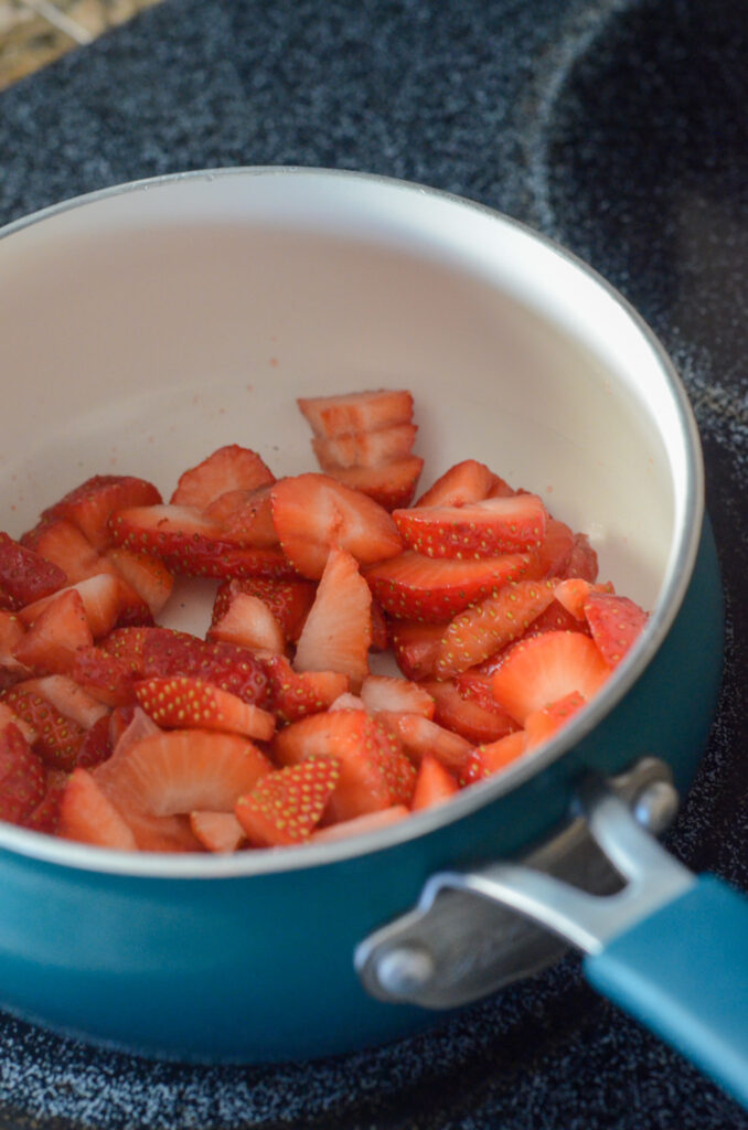 strawberries in saucepan for quick strawberry sauce