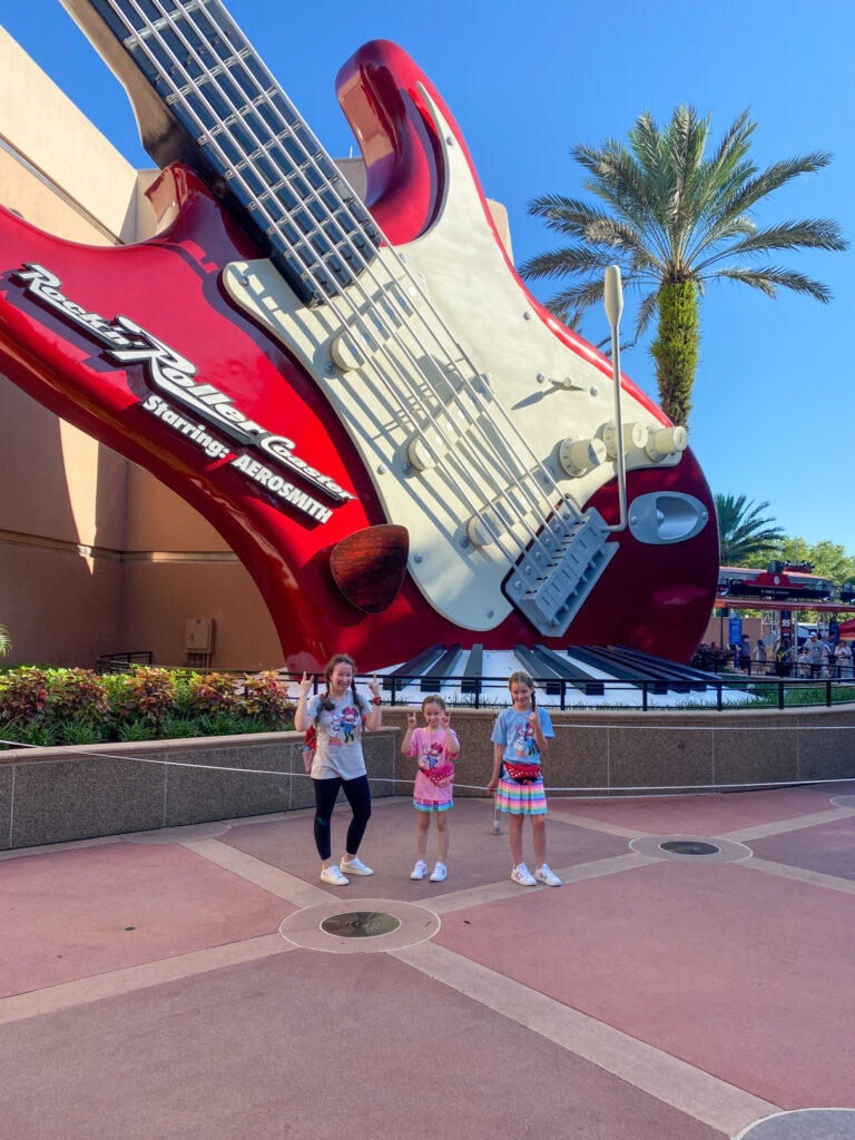 Arkansas lifestyle blogger, Amy, and her children in front of Rock N Roller Coaster at Hollywood Studios