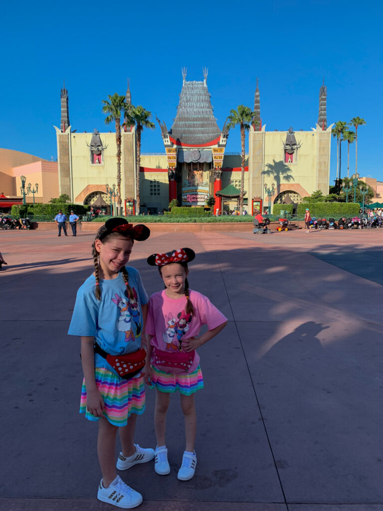 two girls standing in front of Runaway Railroad on first time to Disney Hollywood Studios