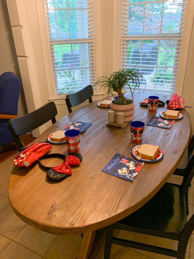 kitchen table set up for a surprise Disney World trip reveal for kids
