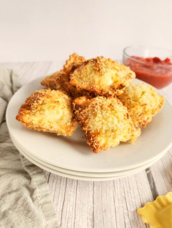 air fryer ravioli on white saucer