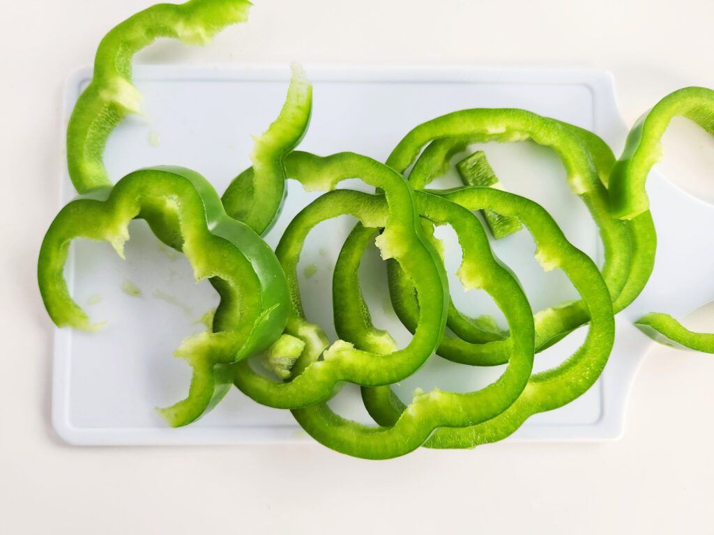 pepper Shamrock rings on white cutting board