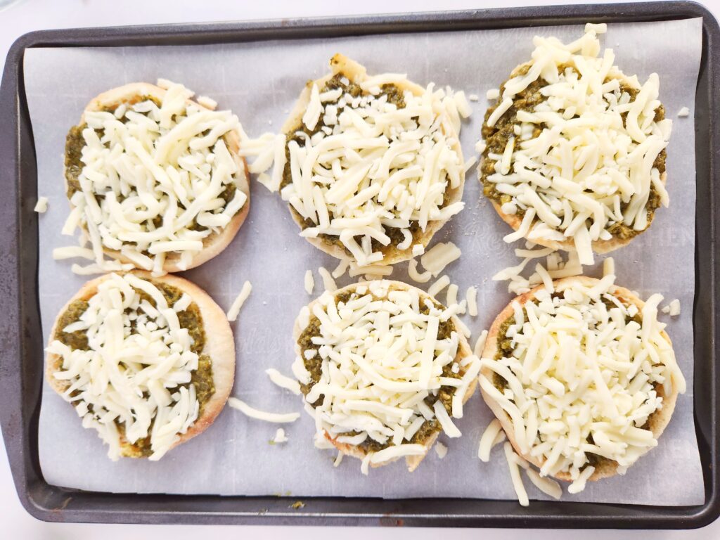 tray of English muffins pizzas for St. Patrick's Day pizza
