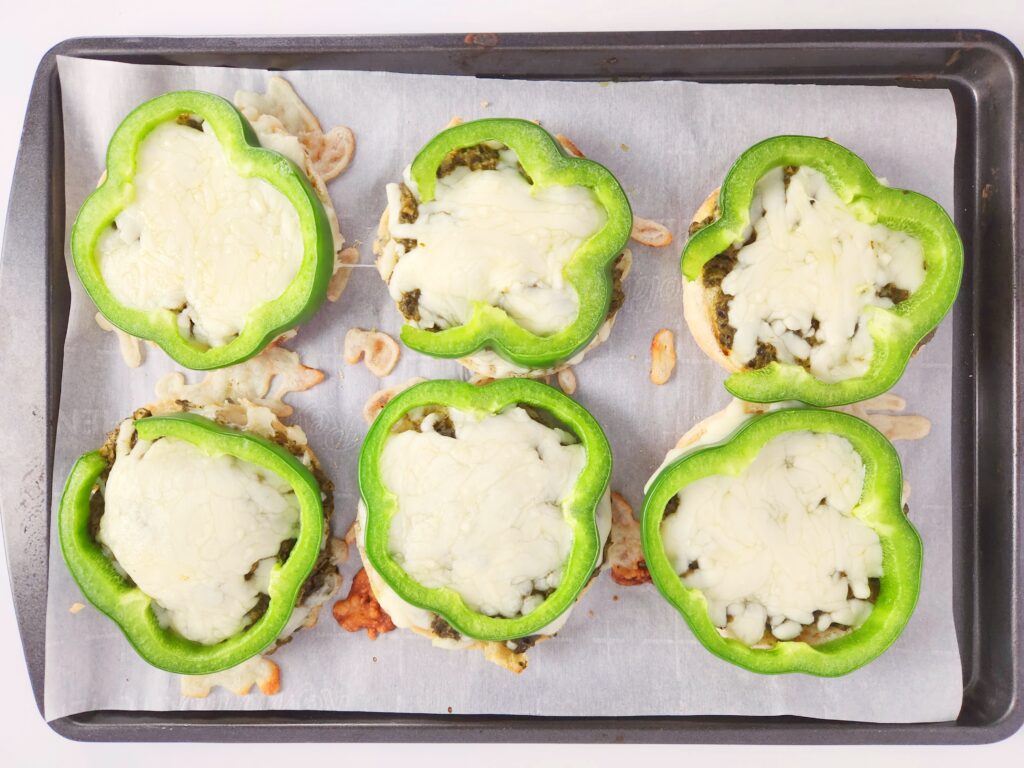 St. Patrick's Day pizza on English muffins on cookie sheet