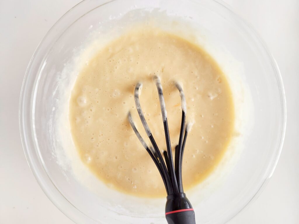 batter in bowl with whisk 