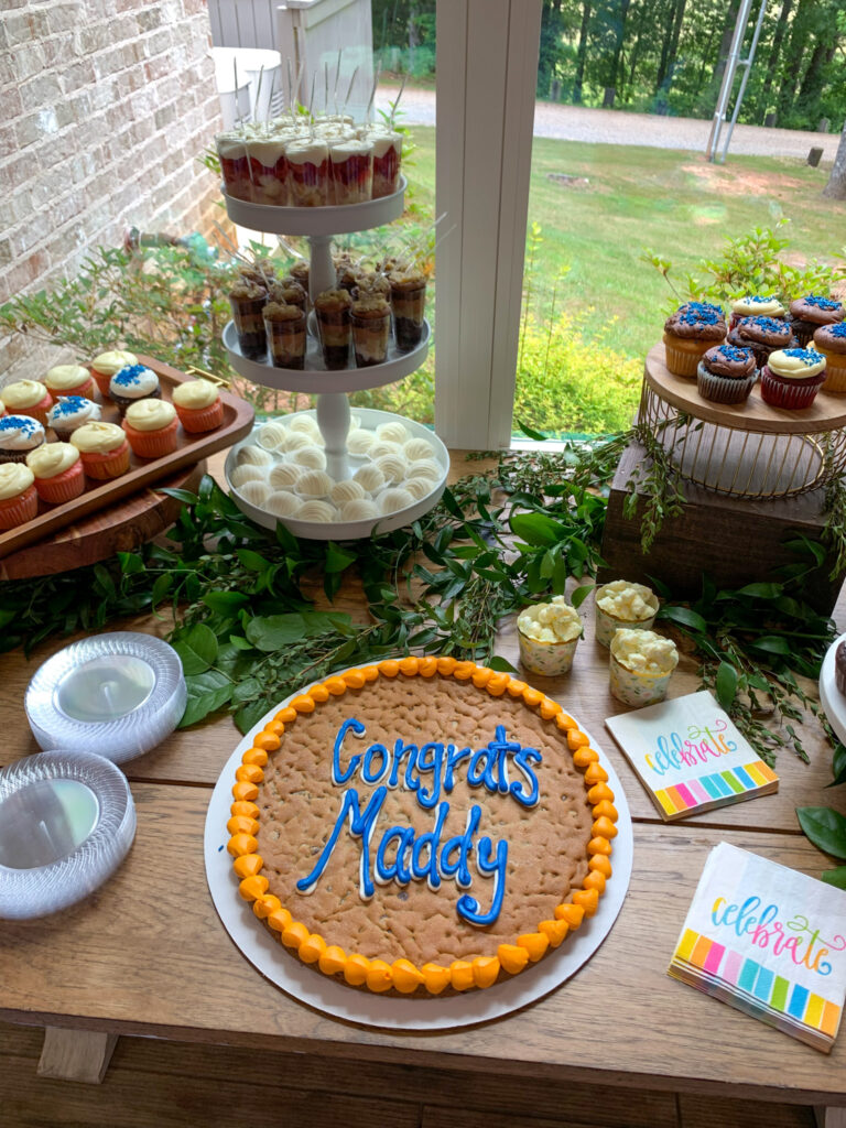 sweets table at a girl's high school graduation party