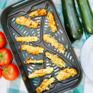 overhead image of air fryer zucchini on cooking tray