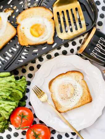 overhead shot of air fryer egg and toast on plate with more TikTok toasts in back