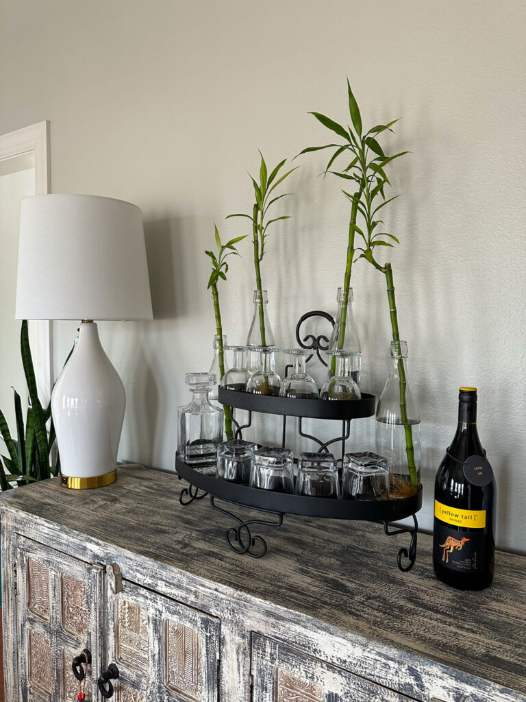 Golden bamboo stalks in vases  on buffet table for animal safe plants ideas
