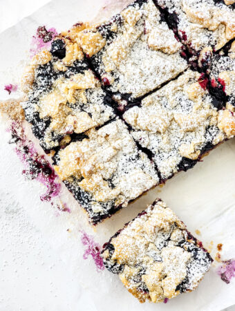 lemon blueberry shortbread bars with one pulled loose