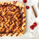 puff pastry fruit tart with peaches on white background