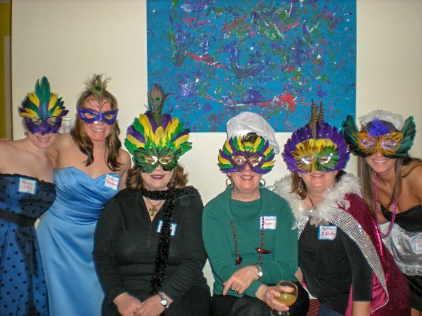 women dressed up for a Mardi Gras murder mystery party for a fun murder mystery box game night