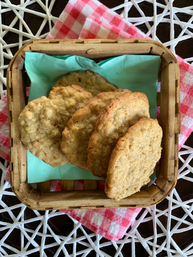 Cinnamon Toast Crunch cookies in a wooden basket on gingham cloth