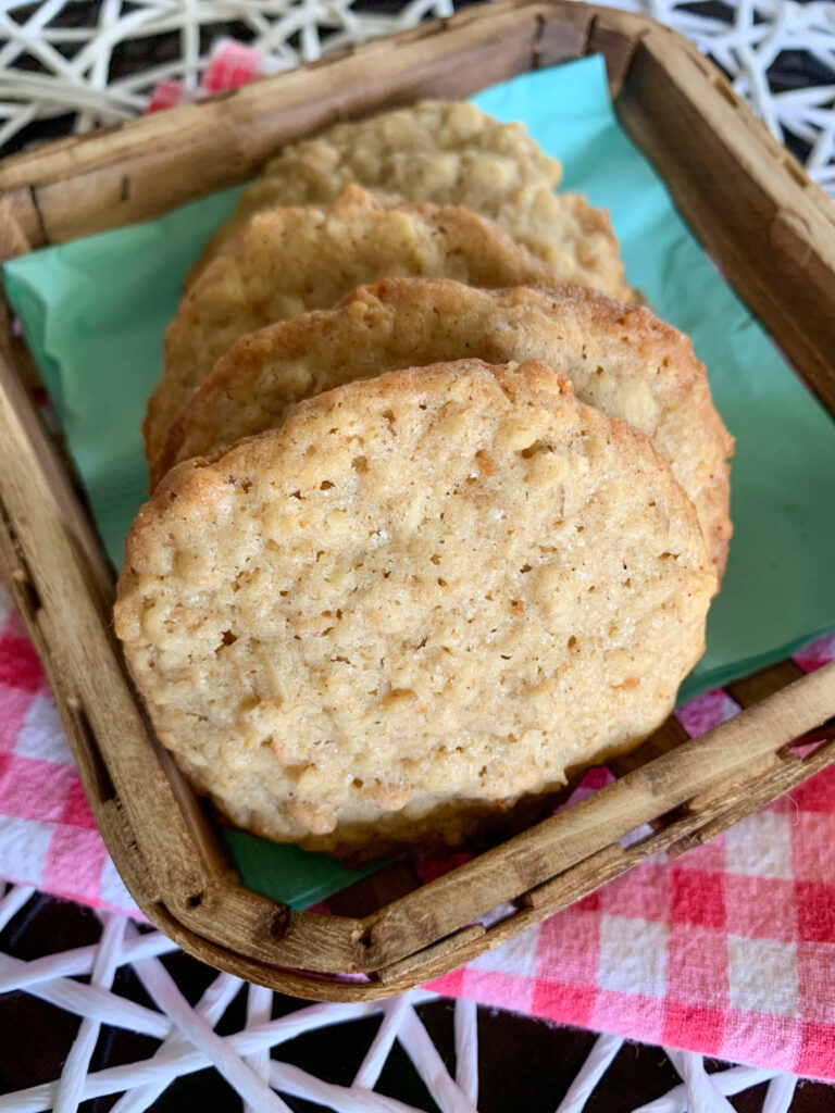 Cinnamon Toast Crunch cinnamon oatmeal cookies in basket on teal napkins