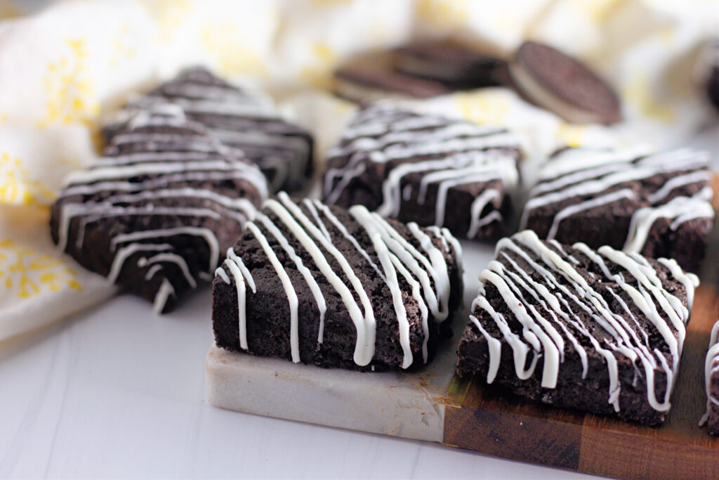 white chocolate Oreo bars with Oreo cookies in back