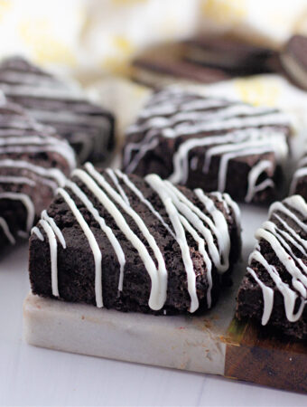 white chocolate Oreo bars with yellow napkin in back