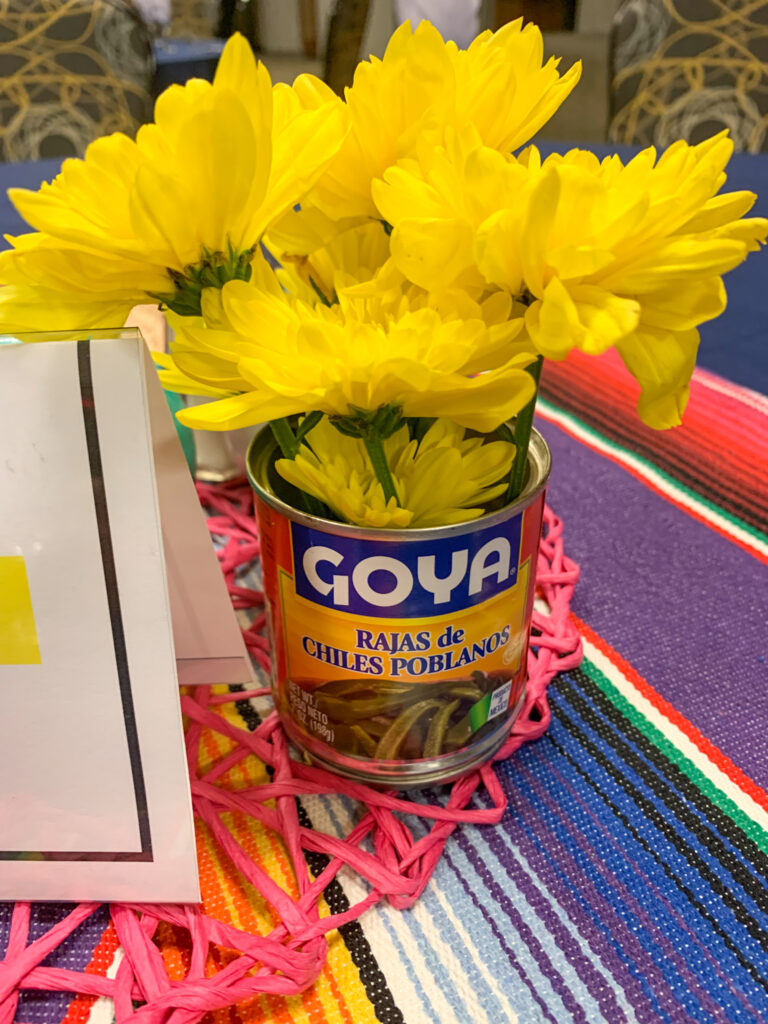 fresh flowers in can of chiles for Mexican flowers centerpieces at fiesta