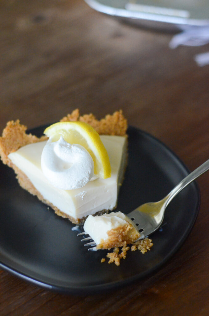 creamy lemon pie with bite on fork