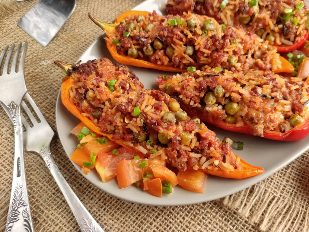 bell pepper tacos on a white round plate with a fork beside