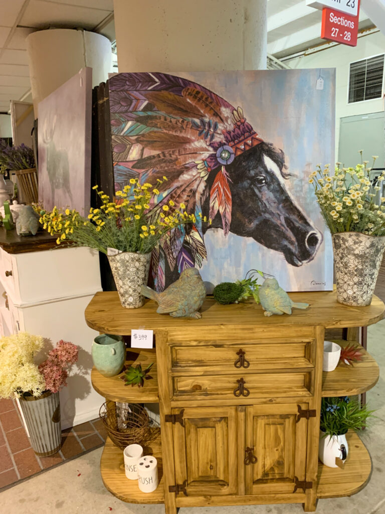 horse artwork on top of cabinet