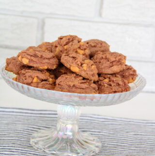 stack of chocolate butterscotch cookies on glass platter