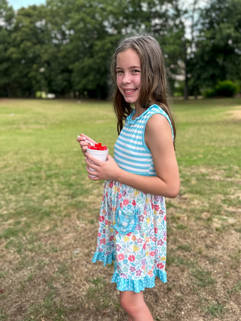girl poses with snow cone from Candy's Snow Cones in central Arkansas