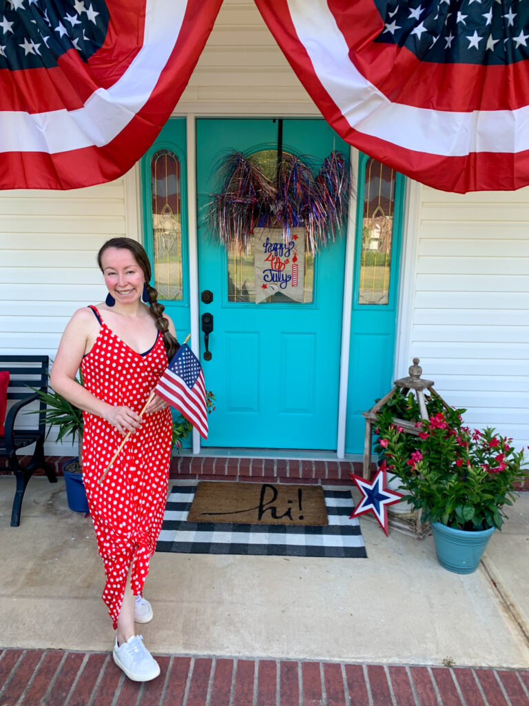 woman wears patriotic dress women could wear for other occasions while holding flag