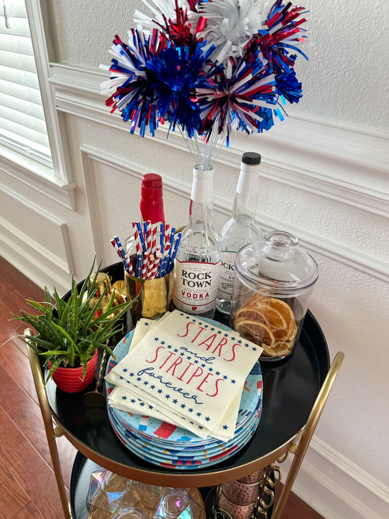 July 4th bar cart top shelf with 4th of July napkins 