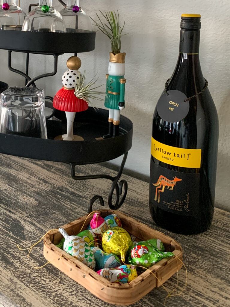 wine and chocolate in a basket on a cabinet at a pairings party