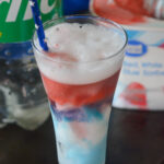 Sprite float with Great Value Red, White, and Blue Sorbet in front of sprite bottle and carton