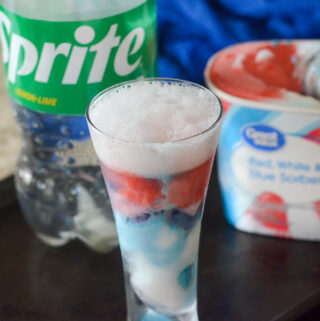 2 ingredient Sprite float in glass with Sprite bottle and patriotic sorbet in back