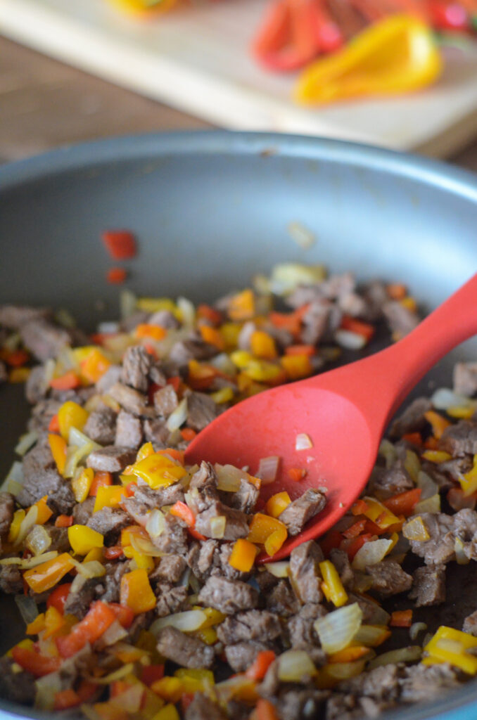 filling for leftover steak quesadilla recipe sauteeing in a pan