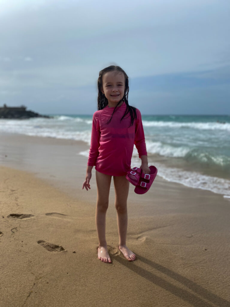 little girl on the shore of Condado Beach
